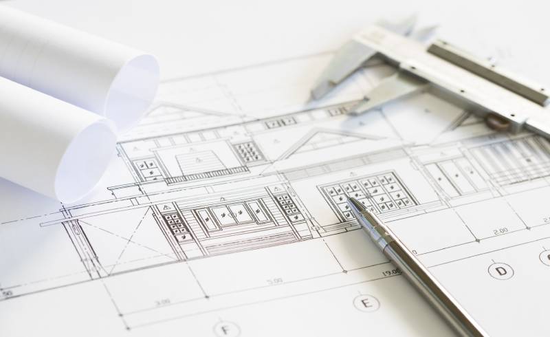 construction-plans-and-drawing-tools-on-blueprints